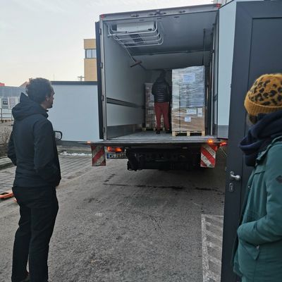 Van with materials and three helpers 